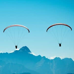 Paragliders flying above Mt Gerlitzen